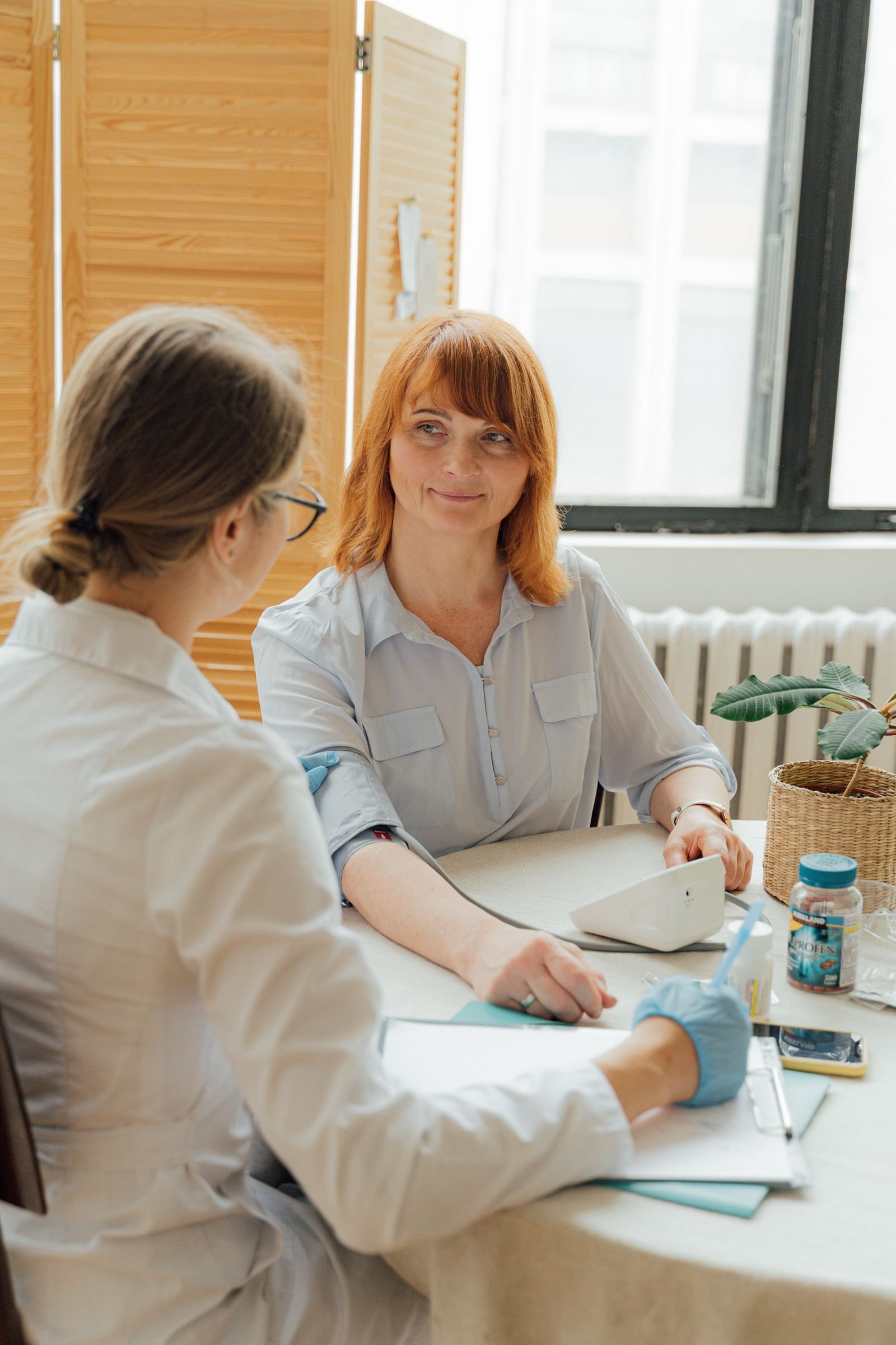 Stock photograph illustrating a doctor listening to a patient